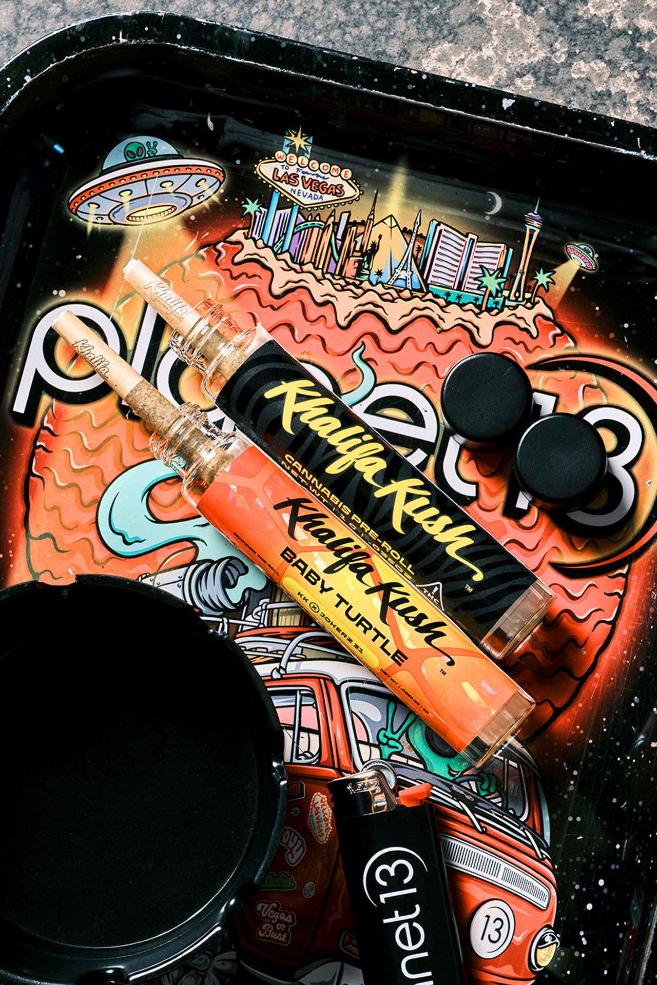 Khalifa Kush pre-rolls on planet 13 rolling tray